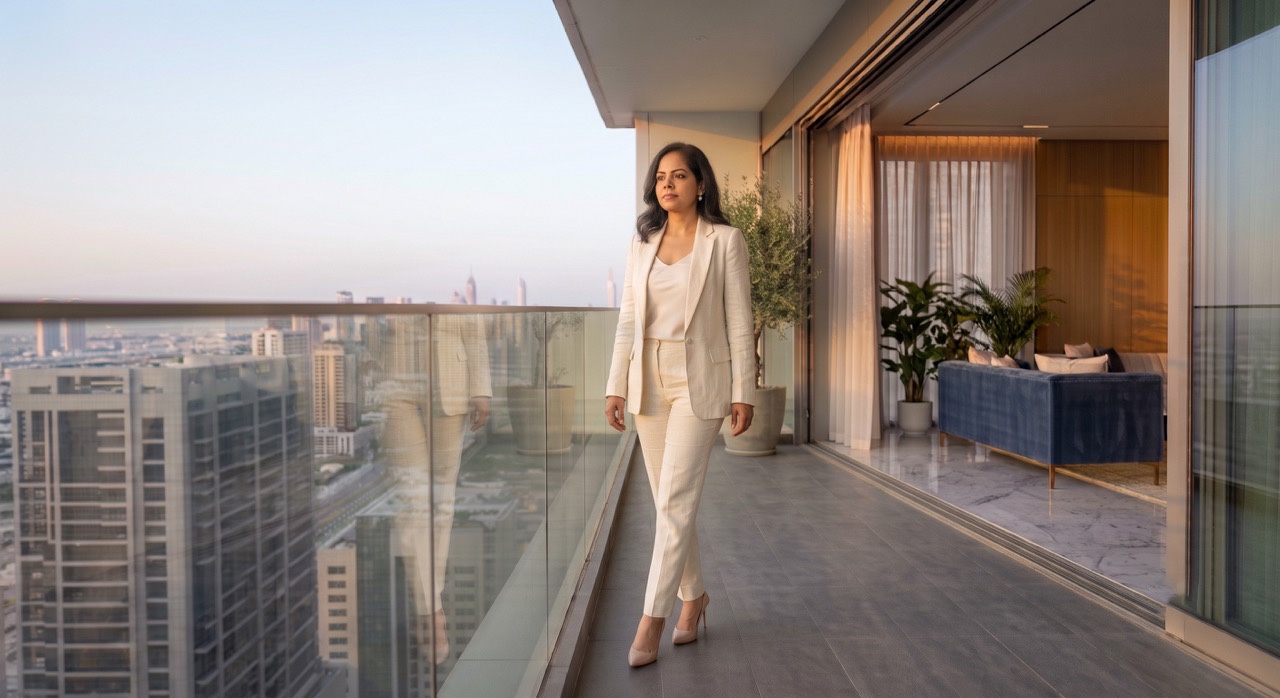 Confident Indian Businesswoman Walking on Luxury Apartment Balcony | Royalty-Free image | Pixlaris