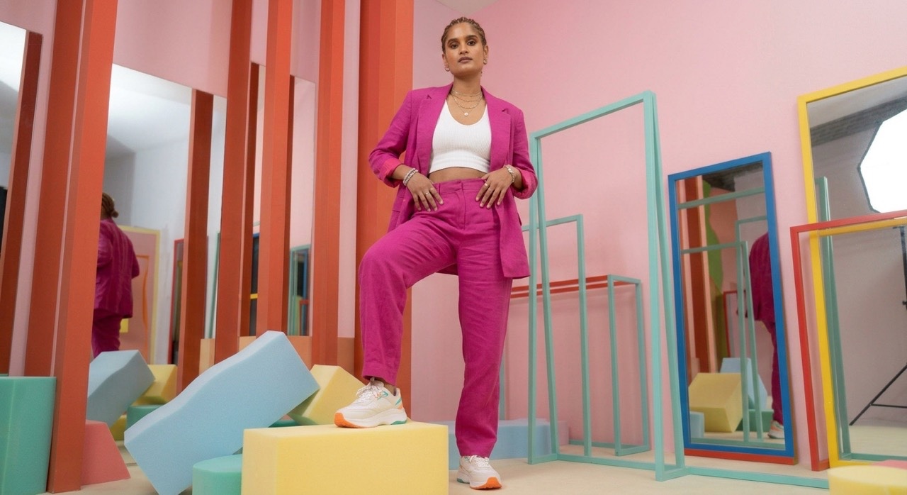 Fashion Model Standing on Geometric Block in Pink Suit | Royalty-Free image | Pixlaris