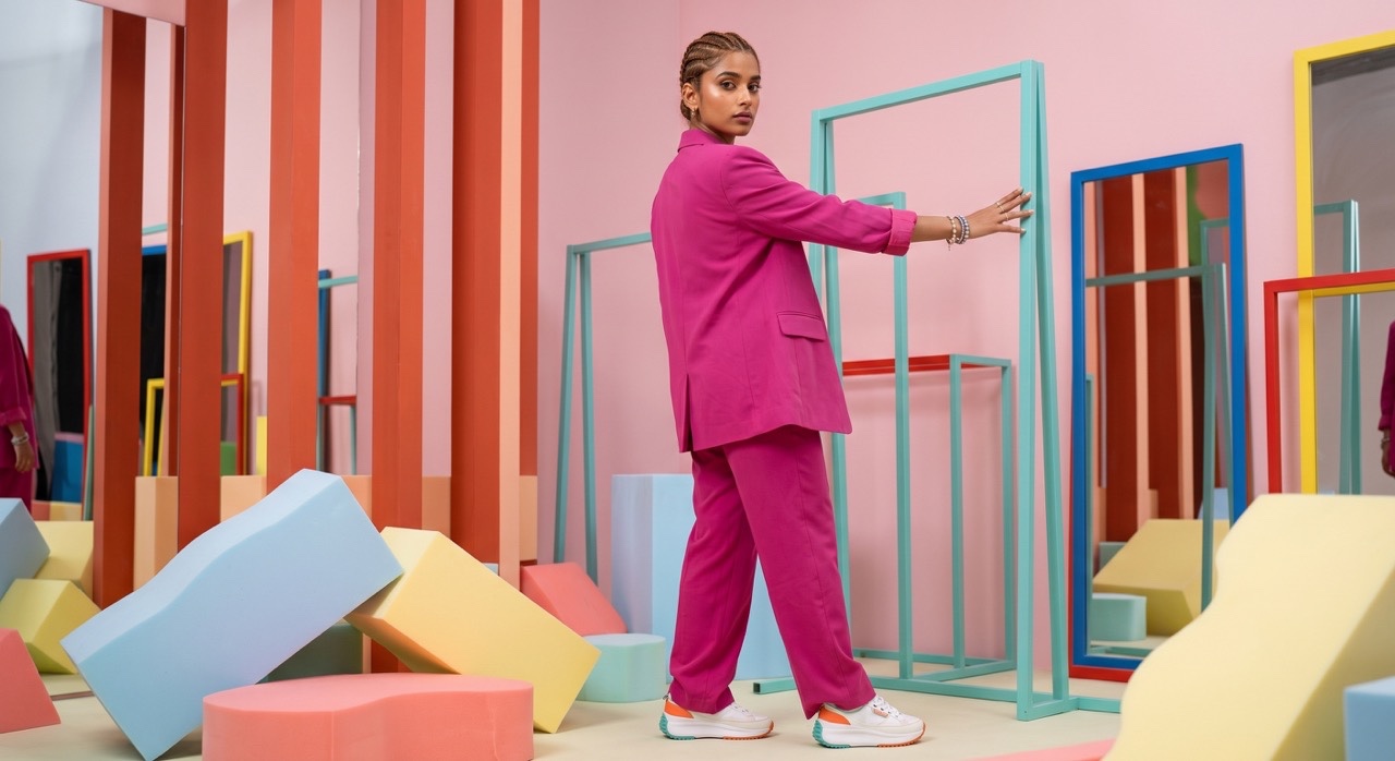 Back View Fashion Pose in Pink Pantsuit | Royalty-Free image | Pixlaris